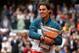 PARIS, FRANCE - JUNE 09: Rafael Nadal of Spain poses with the Coupe des Mousquetaires trophy as he celebrates victory in the men's singles final against David Ferrer of Spain during day fifteen of the French Open at Roland Garros on June 9, 2013 in Paris
