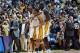 LOS ANGELES - MAY 11: Kobe Bryant #8 of the Los Angeles Lakers hugs teammate Derek Fisher #2 as they walk to the bench along with Shaquille O'Neal #34 against the San Antonio Spurs in Game four of the Western Conference Semifinals during the 2003 NBA Pla