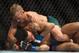 Jan 15, 2014; Duluth, GA, USA; TJ Dilleshaw (red gloves) fights Mike Easton (blue gloves) during UFC Fight Night at Gwinnett Center. Dillashaw won. Mandatory Credit: Joshua S. Kelly-USA TODAY Sports