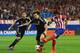 MADRID, SPAIN - APRIL 22: Raul Garcia of Club Atletico de Madrid is tackled by David Luiz of Chelsea during the UEFA Champions League Semi Final first leg match between Club Atletico de Madrid and Chelsea at Vicente Calderon Stadium on April 22, 2014 in