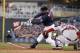 MINNEAPOLIS, MN - MAY 13: Joe Mauer #7 of the Minnesota Twins hits a RBI single in the second inning against the Boston Red Sox and the Twins beat the Red Sox 8-6 during MLB game action on May 13, 2014 at Target Field in Minneapolis, Minnesota. (Photo by
