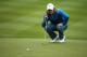 VIRGINIA WATER, ENGLAND - MAY 23: Rory McIlroy of Northern Ireland lines up on the 18th green during day two of the BMW PGA Championship at Wentworth on May 23, 2014 in Virginia Water, England. (Photo by Warren Little/Getty Images)