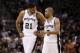 May 4, 2014; San Antonio, TX, USA; San Antonio Spurs forward Tim Duncan (21) talks with guard Tony Parker (9) in game seven of the first round of the 2014 NBA Playoffs against the Dallas Mavericks at AT&T Center. The Spurs won 119-96. Mandatory Credit: S