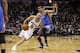 May 21, 2014; San Antonio, TX, USA; San Antonio Spurs guard Tony Parker (9) drives to the basket around Oklahoma City Thunder guard Thabo Sefolosha (25) in game two of the Western Conference Finals of the 2014 NBA Playoffs at AT&T Center. Mandatory Credit