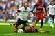 LONDON, ENGLAND - MAY 24: (L-R) Johnny Russell of Derby County is fouled from behind by Gary O'Neil of Queens Park Rangers during the Sky Bet Championship Playoff Final between Derby County and Queens Park Rangers at Wembley Stadium on May 24, 2014 in Lo