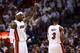 MIAMI, FL - JUNE 21: LeBron James #6 of the Miami Heat gestures on court in the first quarter next to teammate Dwyane Wade #3 against the Oklahoma City Thunder in Game Five of the 2012 NBA Finals on June 21, 2012 at American Airlines Arena in Miami, Flor