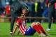 LISBON, PORTUGAL - MAY 24: A dejected Tiago of Club Atletico de Madrid is consoled after defeat during the UEFA Champions League Final between Real Madrid and Atletico de Madrid at Estadio da Luz on May 24, 2014 in Lisbon, Portugal. (Photo by Alex Lives