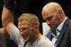 May 24, 2014; Las Vegas, NV, USA; UFC President Dana White puts the bantamweight champion belt on TJ Dillashaw after beating opponent Renan Barao (not pictured) by way of TKO following their UFC 173 bantamweight championship bout at MGM Grand Garden Arena
