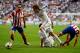 LISBON, PORTUGAL - MAY 24: Juanfran and Gabi of Club Atletico de Madrid close down Ángel Di Maria and Fabio Coentrao of Real Madrid during the UEFA Champions League Final between Real Madrid and Atletico de Madrid at Estadio da Luz on May 24, 2014 in Lis