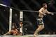 May 24, 2014; Las Vegas, NV, USA;Al Laquinta (red) recovers after tapping out as his opponent Mitch Clarke (blue) celebrates during their UFC 173 lightweight bout at MGM Grand Garden Arena. Clarke won his bout by submission. Mandatory Credit: Stephen R. S