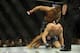 Feb 22, 2014; Las Vegas, NV, USA; Daniel Cormier (red gloves) tries to land a punch from above on Patrick Cummins (blue gloves) during their UFC light heavyweight bout at Mandalay Bay. Cormier won by way of a TKO in the first round. Mandatory Credit: Ste