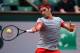 PARIS, FRANCE - MAY 25: Roger Federer of Switzerland returns a shot during his men's singles match against Lukas Lacko of Slovakia on day one of the French Open at Roland Garros on May 25, 2014 in Paris, France. (Photo by Matthias Hangst/Getty Images)