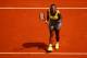 PARIS, FRANCE - MAY 25: Serena Williams of the United States celebrates a point during her women's singles match against Alize Lim of France on day one of the French Open at Roland Garros on May 25, 2014 in Paris, France. (Photo by Clive Brunskill/Getty