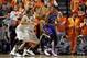 Mar 1, 2014; Stillwater, OK, USA; Kansas Jayhawks center Joel Embiid (21) is defended by Oklahoma State Cowboys forward/center Kamari Murphy (21) and guard Markel Brown (22) during the first half at Gallagher-Iba Arena. Mandatory Credit: Tim Heitman-USA