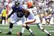 Sep 15, 2013; Baltimore, MD, USA; Baltimore Ravens guard Kelechi Osemele (72) prepares to block Cleveland Browns linebacker Barkevious Mingo (51) during the second half at M&T Bank Stadium. The Ravens won 14 - 6. Mandatory Credit: Brad Mills-USA TODAY Spo