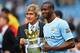 MANCHESTER, ENGLAND - MAY 11: The Manchester City Manager Manuel Pellegrini and Yaya Toure pose with the trophy at the end of the Barclays Premier League match between Manchester City and West Ham United at the Etihad Stadium on May 11, 2014 in Mancheste