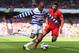 LIVERPOOL, ENGLAND - MAY 19: Loic Remy of Queens Park Rangers competes with Jose Enrique of Liverpool during the Barclays Premier League match between Liverpool and Queens Park Rangers at Anfield on May 19, 2013 in Liverpool, England. (Photo by Julian F