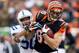CINCINNATI, OH - DECEMBER 08: Tyler Eifert #85 of the Cincinnati Bengals runs with the ball while defended by Jerrell Freeman #50 of the Indianapolis Colts during the NFL game at Paul Brown Stadium on December 8, 2013 in Cincinnati, Ohio. (Photo by Andy