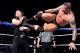 Randy Orton hits a dropkick on Dean Ambrose.