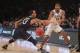 Mar 30, 2014; New York, NY, USA; Michigan State Spartans guard Gary Harris (14) passes the ball against Connecticut Huskies guard Shabazz Napier (13) during the first half in the finals of the east regional of the 2014 NCAA Mens Basketball Championship to