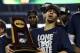 Apr 7, 2014; Arlington, TX, USA; Connecticut Huskies guard Shabazz Napier (13) holds the national championship trophy after defeating the Kentucky Wildcats in the championship game of the Final Four in the 2014 NCAA Mens Division I Championship tournament