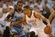 Apr 29, 2014; Oklahoma City, OK, USA; Oklahoma City Thunder guard Thabo Sefolosha (25) dribbles the ball as Memphis Grizzlies guard Mike Conley (11) defends during the second quarter in game five of the first round of the 2014 NBA Playoffs at Chesapeake E