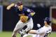 May 21, 2014; San Diego, CA, USA; Minnesota Twins second baseman Brian Dozier (2) has a double play broken up by San Diego Padres first baseman Yonder Alonso (23) during the sixth inning at Petco Park. Mandatory Credit: Christopher Hanewinckel-USA TODAY S