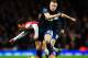 LONDON, ENGLAND - FEBRUARY 12: Santi Cazorla (L) of Arsenal is challenged by Tom Cleverley (R) of Manchester United during the Barclays Premier League match between Arsenal and Manchester United at the Emirates Stadium on February 12, 2014 in London, Eng