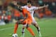 JERUSALEM, ISRAEL - JUNE 09: Ibragim Tsallagov of Russia tries to tackle Bruno Martins Indi of The Netherlands during UEFA European U21 Championships, Group B match between The Netherlands and Russia at Teddy Stadium on June 9, 2013 in Jerusalem, Israel