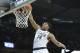 Mar 22, 2014; Spokane, WA, USA; Michigan State Spartans guard Gary Harris (14) dunks against the Harvard Crimson in the first half of a men's college basketball game during the third round of the 2014 NCAA Tournament at Veterans Memorial Arena. Mandatory