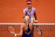 PARIS, FRANCE - MAY 27: Na Li of China shakes hands at the net with Kristina Mladenovic of France after her defeat in the women's singles match on day three of the French Open at Roland Garros on May 27, 2014 in Paris, France. (Photo by Clive Brunskill/