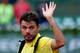 PARIS, FRANCE - MAY 26: Stanislas Wawrinka of Switzerland waves to the crowd as he leaves court following his defeat in his men's singles match against Guillermo Garcia-Lopez of Spain on day two of the French Open at Roland Garros on May 26, 2014 in Pari