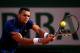 PARIS, FRANCE - MAY 25: Jo-Wilfried Tsonga of France returns a shot during his men's singles match against Edouard Roger-Vasselin of France on day one of the French Open at Roland Garros on May 25, 2014 in Paris, France. (Photo by Clive Brunskill/Getty