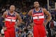 OAKLAND, CA - JANUARY 28: Bradley Beal #3 chats with teammate John Wall #2 of the Washington Wizards while facing the Golden State Warriors on January 28, 2014 at Oracle Arena in Oakland, California. NOTE TO USER: User expressly acknowledges and agrees th