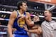 Oct 31, 2013; Los Angeles, CA, USA; NBA referee Ed Malloy (14) holds back Golden State Warriors center Andrew Bogut (12) after a foul on Los Angeles Clippers center DeAndre Jordan (not pictured) in the second quarter of the game at Staples Center. Manda