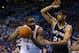 OKLAHOMA CITY, OK - MAY 27: Kendrick Perkins #5 of the Oklahoma City Thunder handles the ball against Tim Duncan #21 of the San Antonio Spurs in the third quarter during Game Four of the Western Conference Finals of the 2014 NBA Playoffs at Chesapeake Ene