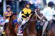 LOUISVILLE, KY - MAY 03: Commanding Curve #17, ridden by Shaun Bridgmohan, takes part in the post parade prior the 140th running of the Kentucky Derby at Churchill Downs on May 3, 2014 in Louisville, Kentucky. (Photo by Rob Carr/Getty Images)