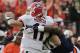 Georgia QB Aaron Murray is sacked by Auburn DE Dee Ford
