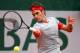 PARIS, FRANCE - MAY 28: Roger Federer of Switzerland returns a shot during his men';s singles match against Diego Sebastian Schwartzman of Argentina on day four of the French Open at Roland Garros on May 28, 2014 in Paris, France. (Photo by Clive Brunsk