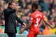 NORWICH, ENGLAND - APRIL 20: Raheem Sterling of Liverpool celebrates scoring the opening goal with Manager Brendan Rodgers of Liverpool during the Barclays Premier League match between Norwich City and Liverpool at Carrow Road on April 20, 2014 in Norwic