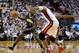 May 26, 2014; Miami, FL, USA; Indiana Pacers guard Lance Stephenson (1) moves the ball around guarded by Miami Heat center Chris Bosh (1) and guard Norris Cole (30) in game four of the Eastern Conference Finals of the 2014 NBA Playoffs at American Airline