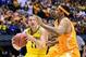Mar 28, 2014; Indianapolis, IN, USA; Michigan Wolverines guard Nik Stauskas (11) drives to the basket against Tennessee Volunteers forward Jarnell Stokes (right) in the second half in the semifinals of the midwest regional of the 2014 NCAA Mens Basketball