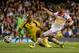 LONDON, ENGLAND - MAY 28: Shaun Maloney of Scotland beats the dive of Austine Ejide of Nigeria during the International Friendly match between Nigeria and Scotland at Craven Cottage on May 28, 2014 in London, United Kingdom. (Photo by Jamie McDonald/Get