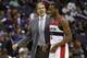 Nov 23, 2013; Washington, DC, USA; Washington Wizards point guard John Wall (2) smiles while talking to Wizards head coach Randy Wittman against the New York Knicks in the fourth quarter at Verizon Center. The Wizards won 98-89. Mandatory Credit: Geoff B