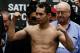 HOUSTON, TX - DECEMBER 14: Nonito Donaire of the Philippines poses on stage at his official weigh-in at PlazAmericas Mall a day prior to his fight with Jorge Arce of Mexico on December 14, 2012 in Houston, Texas. (Photo by Scott Halleran/Getty Images)