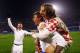 ZAGREB, CROATIA - NOVEMBER 19: Mario Mandzukic of Croatia celebrates with team mate Luka Modric (top) after the FIFA 2014 World Cup Qualifier play-off second leg match between Croatia and Iceland at Maksimir Stadium on November 19, 2013 in Zagreb, Croati
