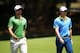 SYDNEY, AUSTRALIA - NOVEMBER 30: Adam Scott of Australia (L) walks with playing partner Rory McIlroy of Northern Ireland (R) during day three of the Australian Open at Royal Sydney Golf Club on November 30, 2013 in Sydney, Australia. (Photo by Matt King