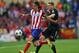 MADRID, SPAIN - APRIL 22: Andre Schurrle of Chelsea battles for the ball with Filipe Luis of Atletcio Madrid during the UEFA Champions League Semi Final first leg match between Club Atletico de Madrid and Chelsea at Vicente Calderon Stadium on April 22,