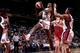 HOUSTON - 1998: Monica Lamb #40 of the Houston Comets grabs a rebound against the Phoenix Mercury during a WNBA game at the Summit in Houston, Texas. NOTE TO USER: User expressly acknowledges that, by downloading and or using this photograph, User is con