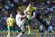 NORWICH, ENGLAND - AUGUST 11: Bradley Johnson of Norwich City challenges for the ball with Havard Nordtveit of Borussia Monchengladbach during the pre season match between Norwich City and Borussia Monchengladbach at Carrow Road on August 11, 2012 in Nor